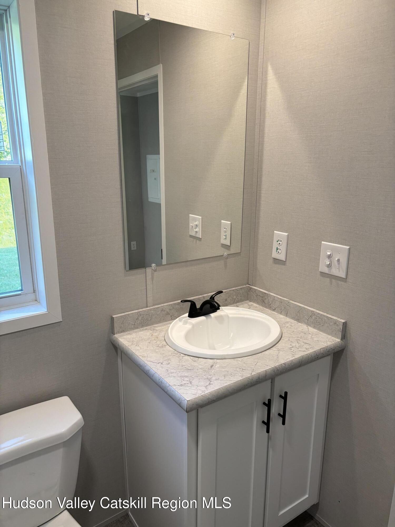 20 Mt View Way Stephentown, NY 12168 - Photo 7 of 14 a bathroom with a sink and a toilet