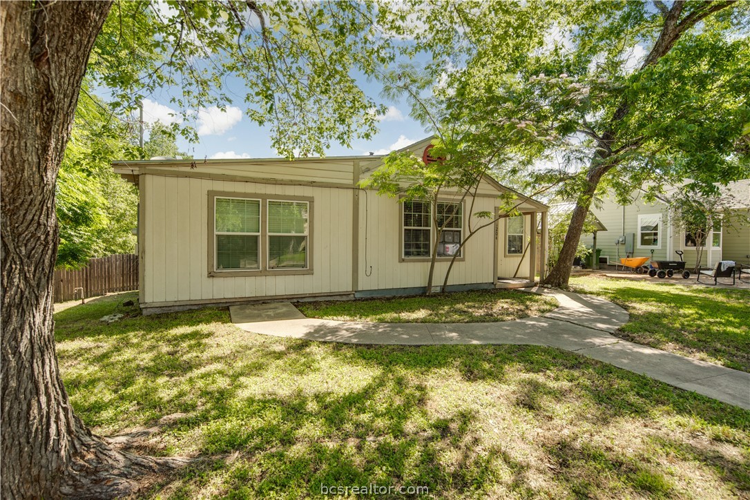 1204 East 28th Street Bryan, TX 77803 - Photo 3 of 22 a view of a house with a tree