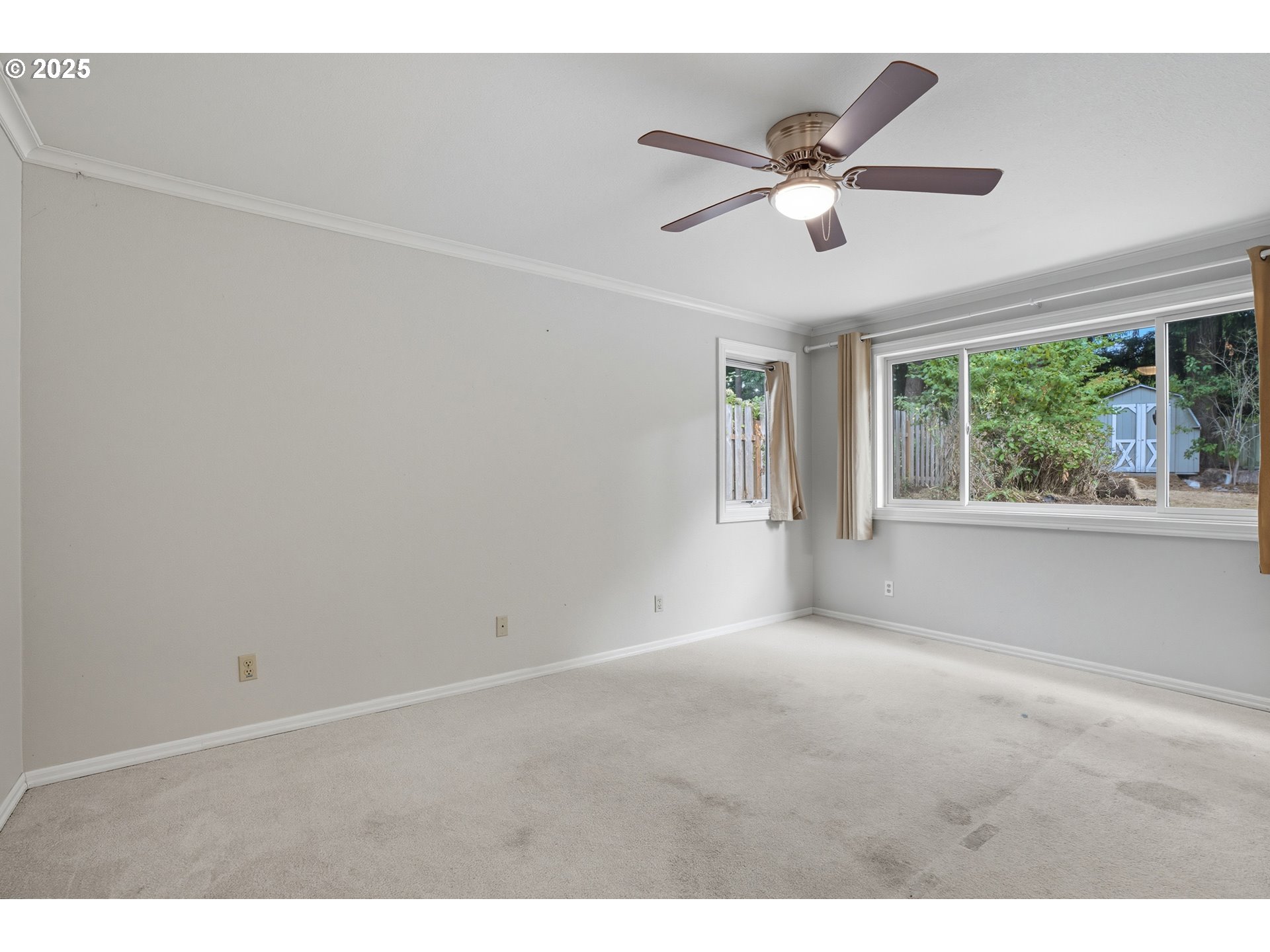 9360 Southwest Meadow Lane Portland, OR 97225 - Photo 16 of 48 a view of an empty room with a window