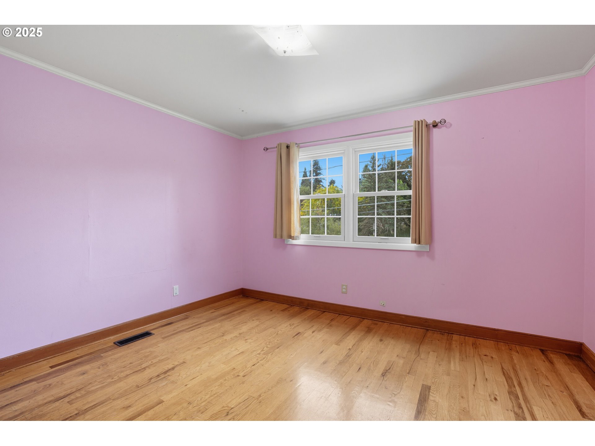 9360 Southwest Meadow Lane Portland, OR 97225 - Photo 23 of 48 an empty room with wooden floor and windows