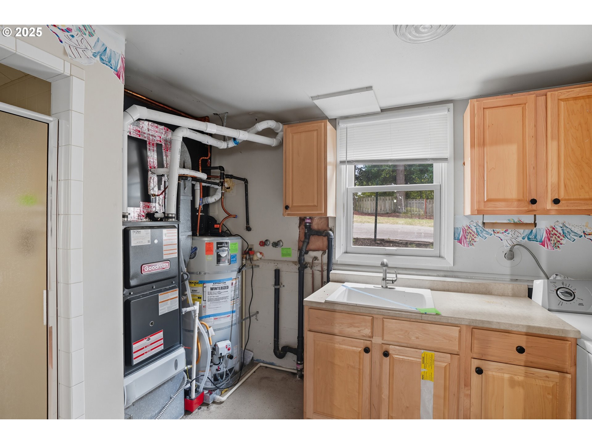 9360 Southwest Meadow Lane Portland, OR 97225 - Photo 27 of 48 a bathroom with a sink double vanity and a window
