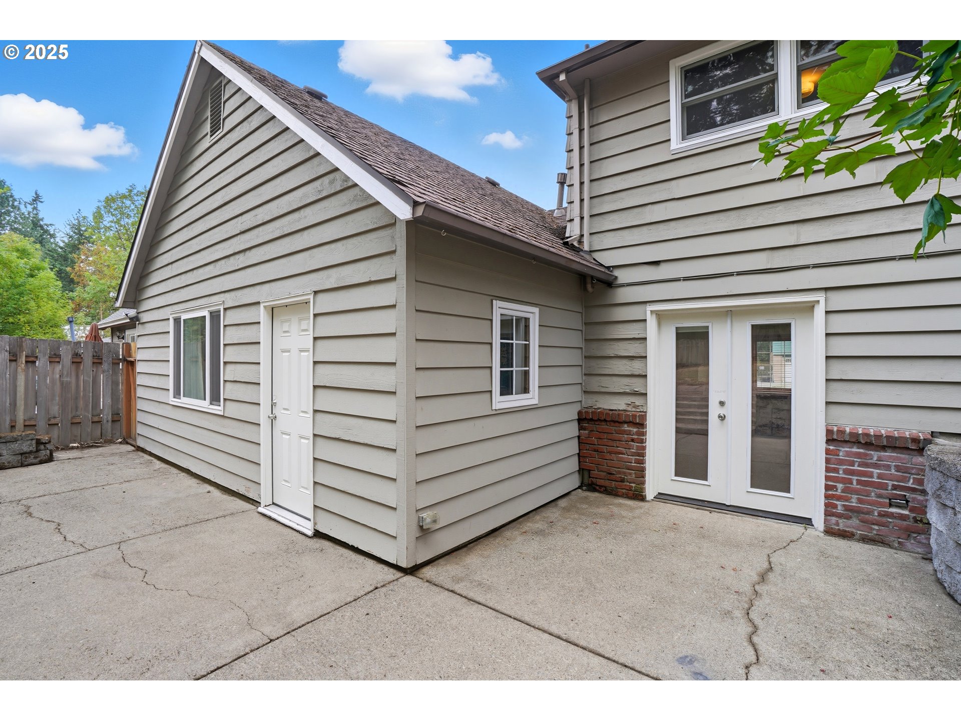 9360 Southwest Meadow Lane Portland, OR 97225 - Photo 30 of 48 a view of a house with a backyard