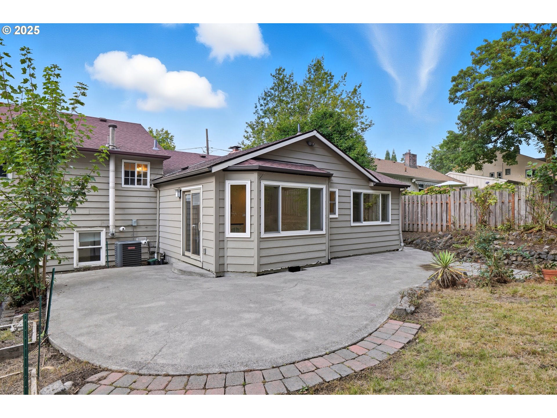 9360 Southwest Meadow Lane Portland, OR 97225 - Photo 31 of 48 a view of a house with a yard