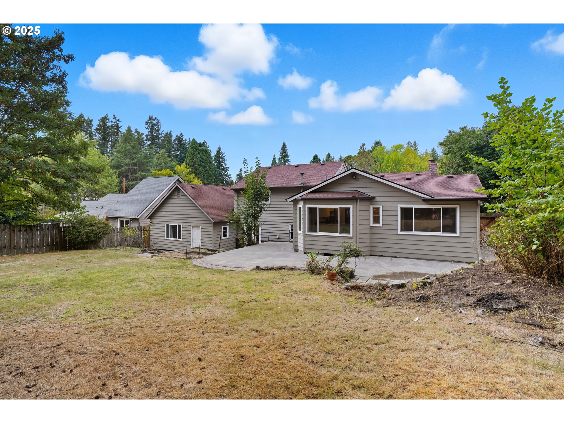 9360 Southwest Meadow Lane Portland, OR 97225 - Photo 34 of 48 a view of a yard in front of the house