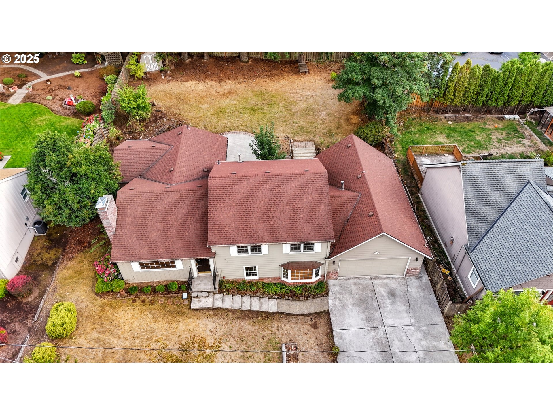 9360 Southwest Meadow Lane Portland, OR 97225 - Photo 36 of 48 a aerial view of a house with a yard and lake view