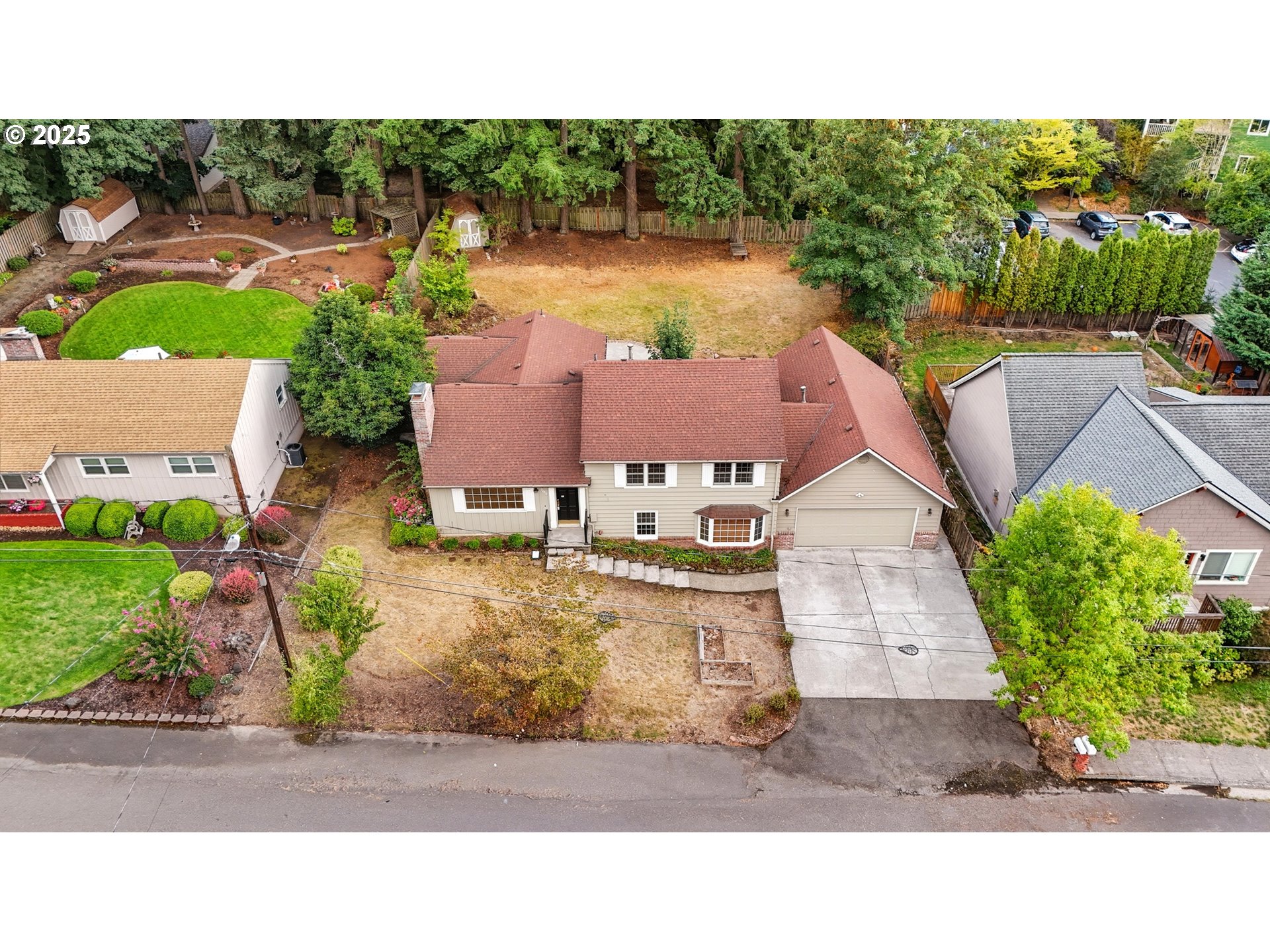 9360 Southwest Meadow Lane Portland, OR 97225 - Photo 43 of 48 a aerial view of a house with a yard and lake view