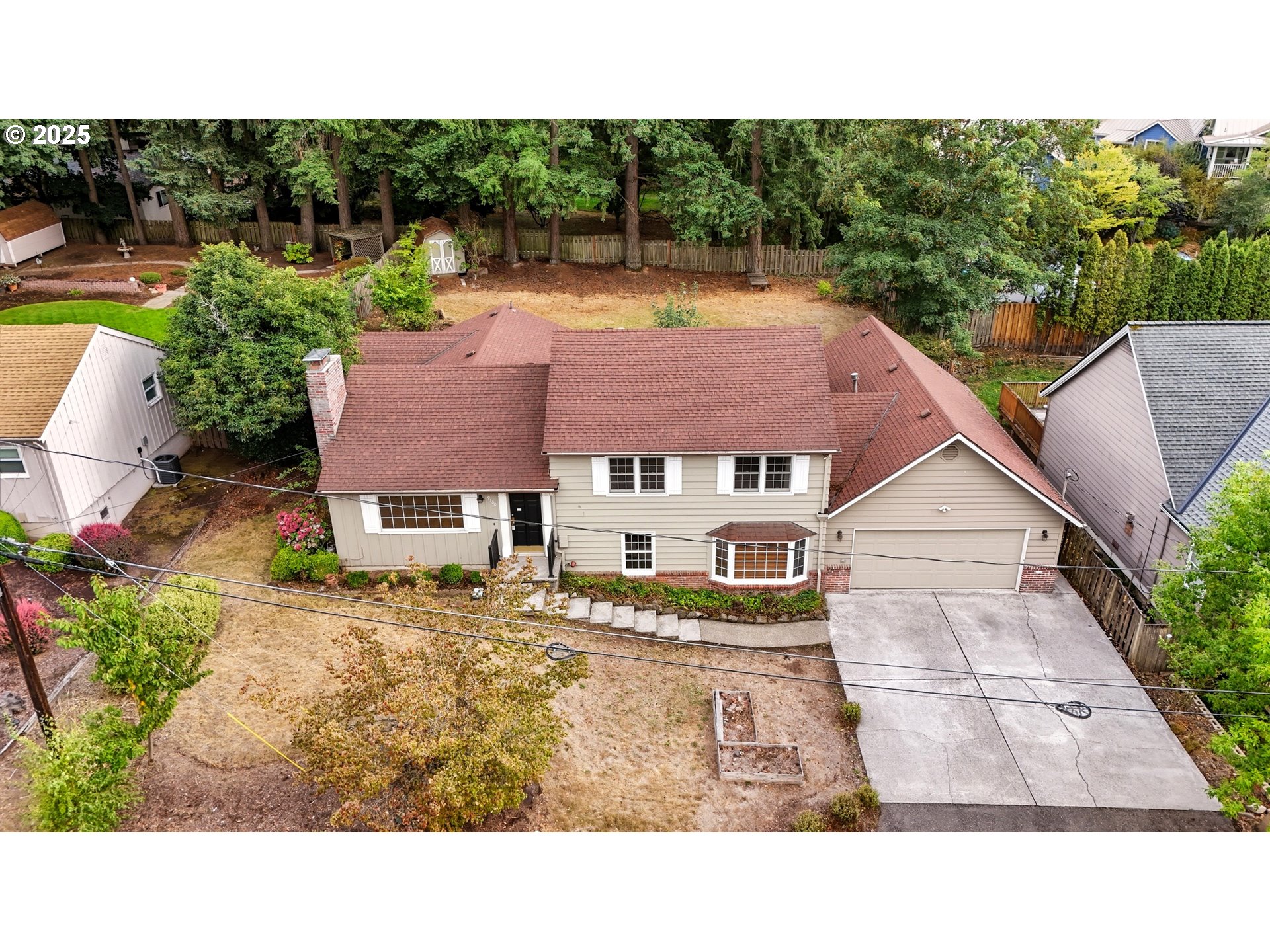 9360 Southwest Meadow Lane Portland, OR 97225 - Photo 45 of 48 a view of a house with a swimming pool