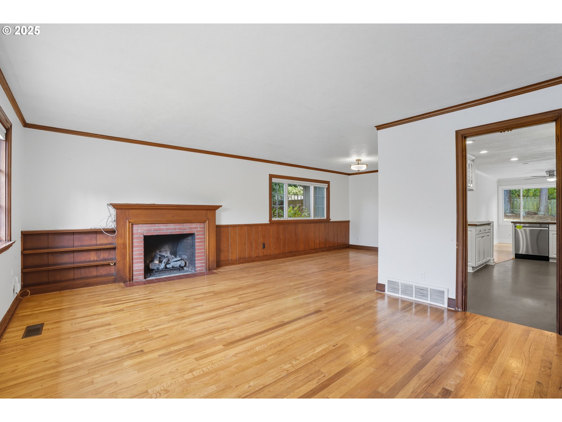 9360 Southwest Meadow Lane Portland, OR 97225 - Photo 7 of 48 a view of empty room with wooden floor