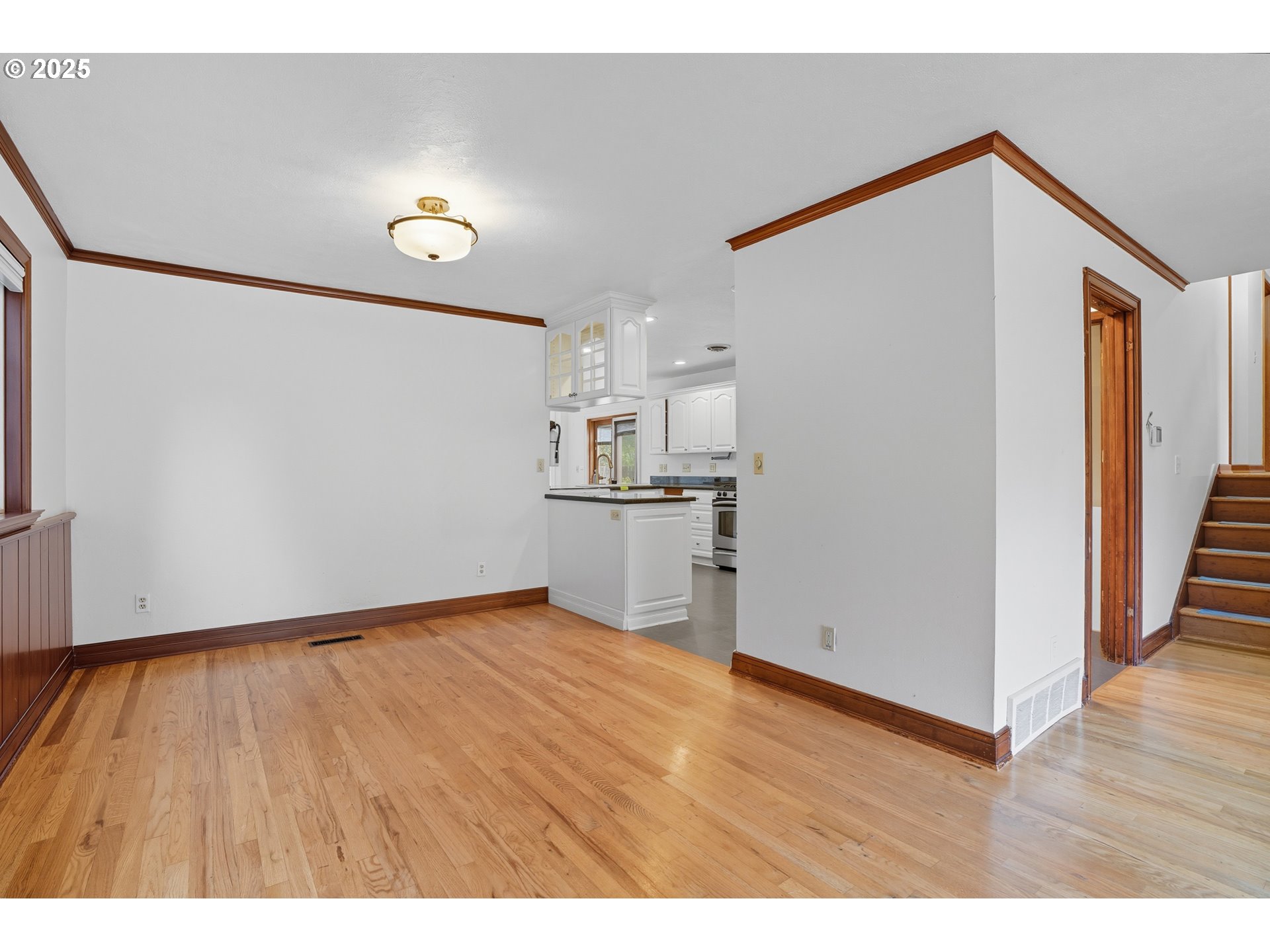 9360 Southwest Meadow Lane Portland, OR 97225 - Photo 9 of 48 a view of empty room with wooden floor