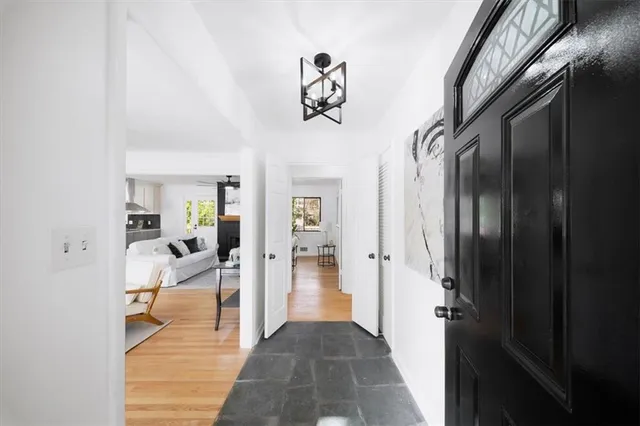 a view of a hallway with dining area
