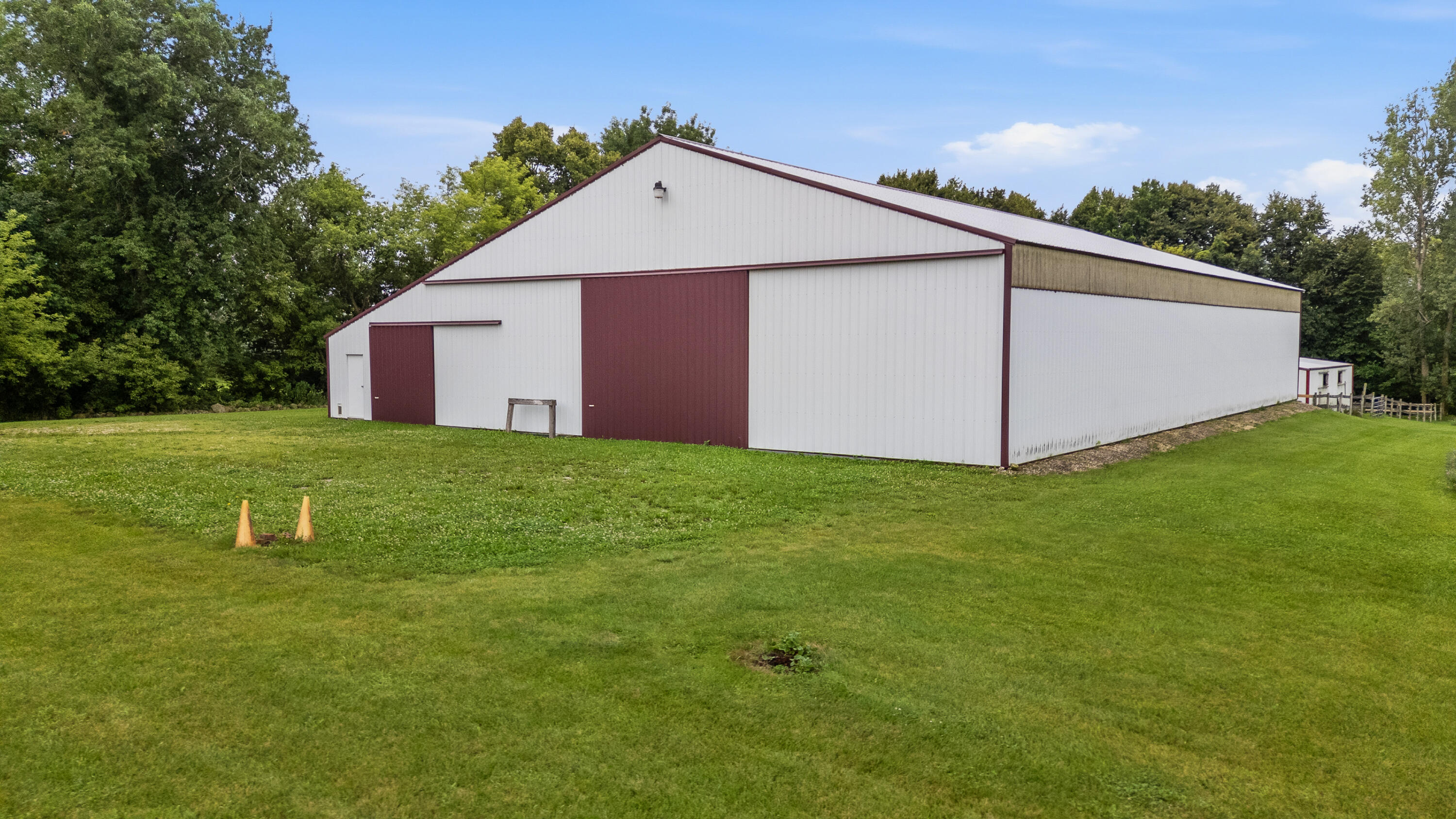 N6745 Mine Road Hubbard, WI 53035 - Photo 4 of 54 Seller did have a new roof of outbuilding completed June on 2026. Separate electrical to barn & 2 water hydrants in front & back of building.
