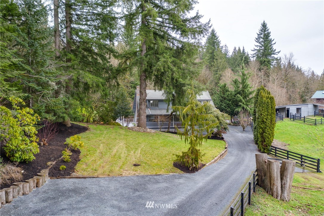 611 Newberg Road Snohomish, WA 98290 - Photo 1 of 40 a view of a swimming pool with a yard