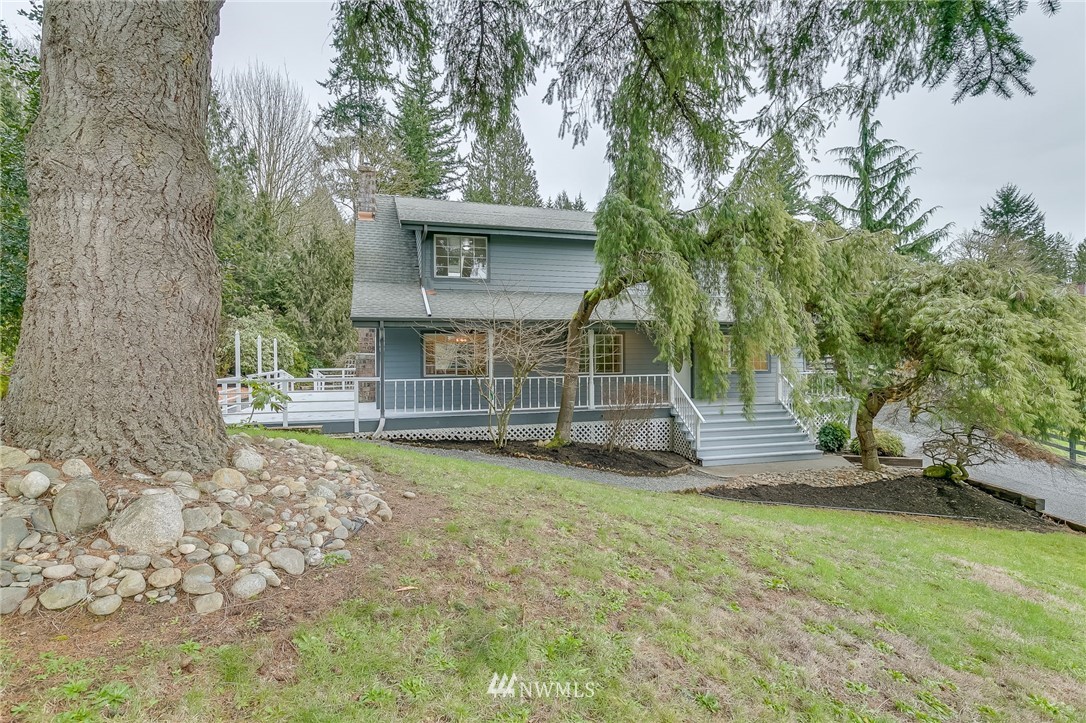 611 Newberg Road Snohomish, WA 98290 - Photo 2 of 40 a view of a house with a yard