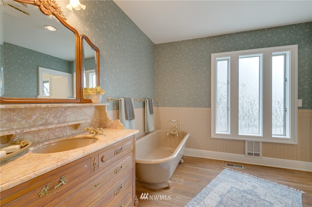 611 Newberg Road Snohomish, WA 98290 - Photo 23 of 40 a bathroom with a sink and a mirror