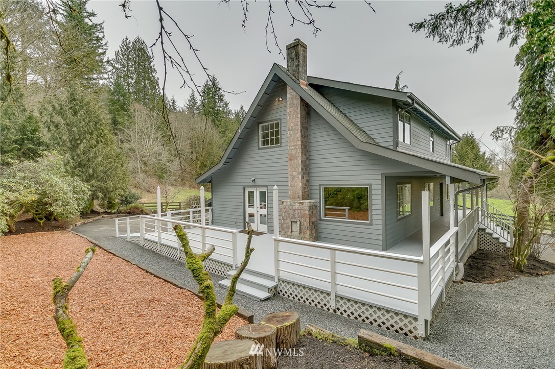 611 Newberg Road Snohomish, WA 98290 - Photo 3 of 40 a view of a house with backyard and sitting area