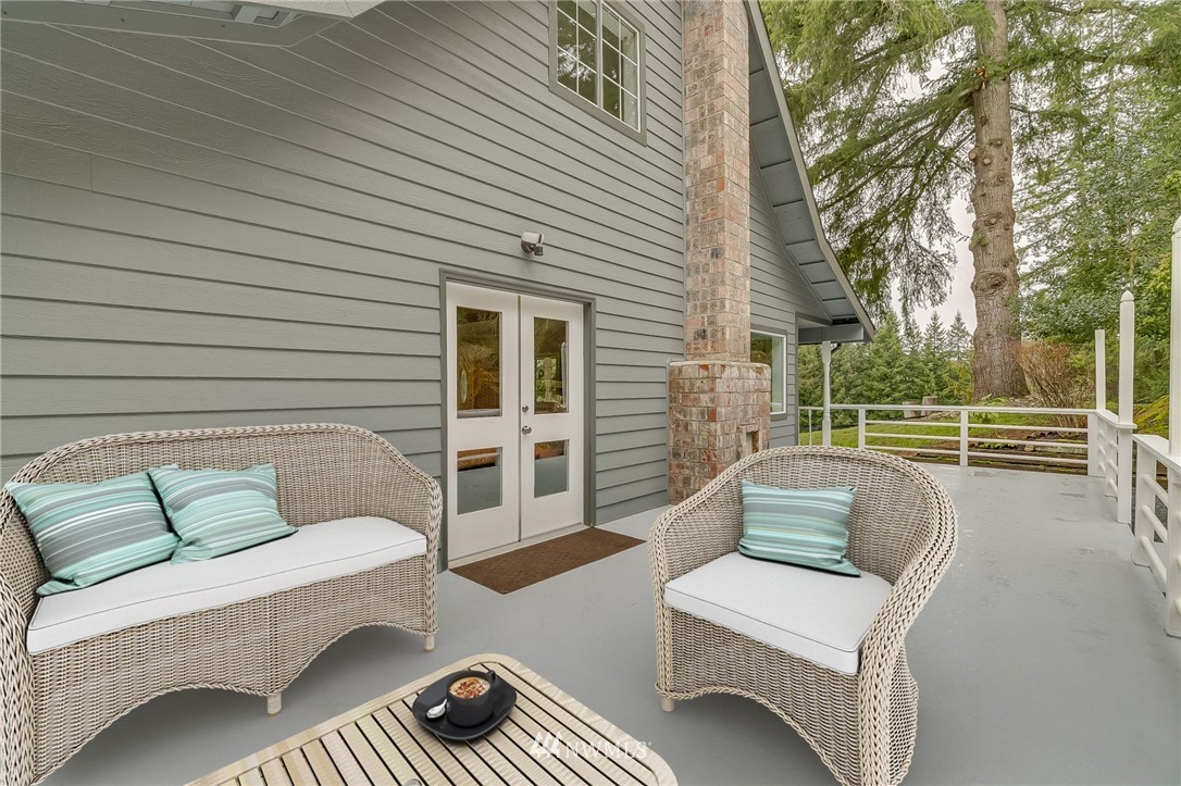 611 Newberg Road Snohomish, WA 98290 - Photo 34 of 40 a view of a patio with couches chairs and wooden floor