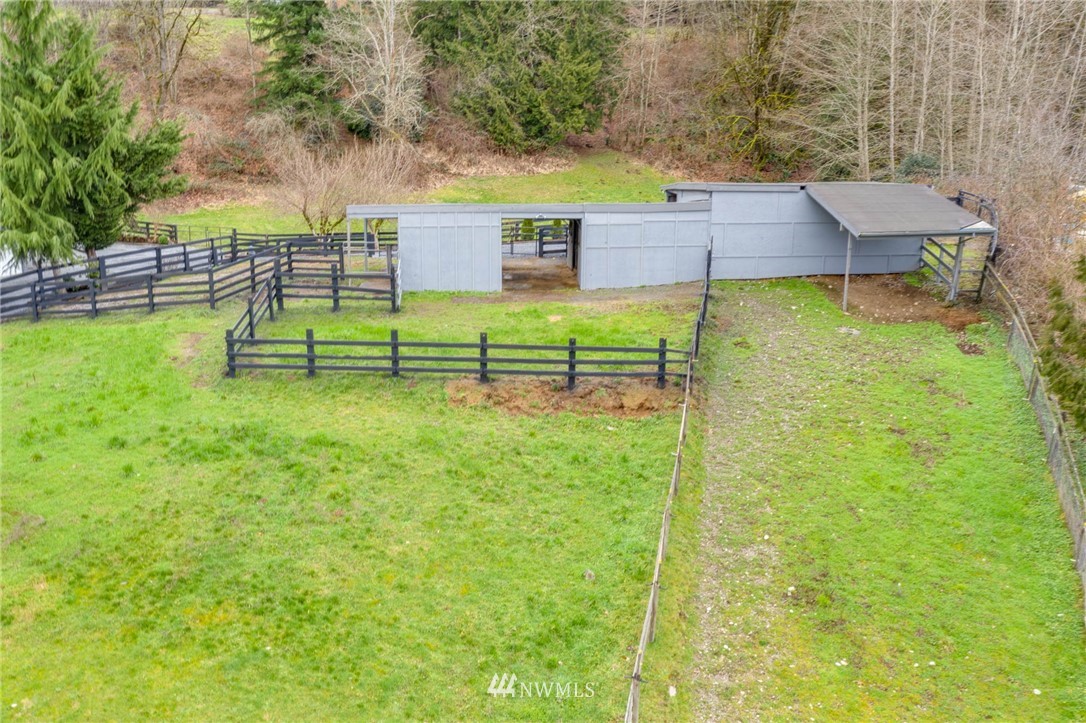 611 Newberg Road Snohomish, WA 98290 - Photo 35 of 40 a view of a house with a backyard