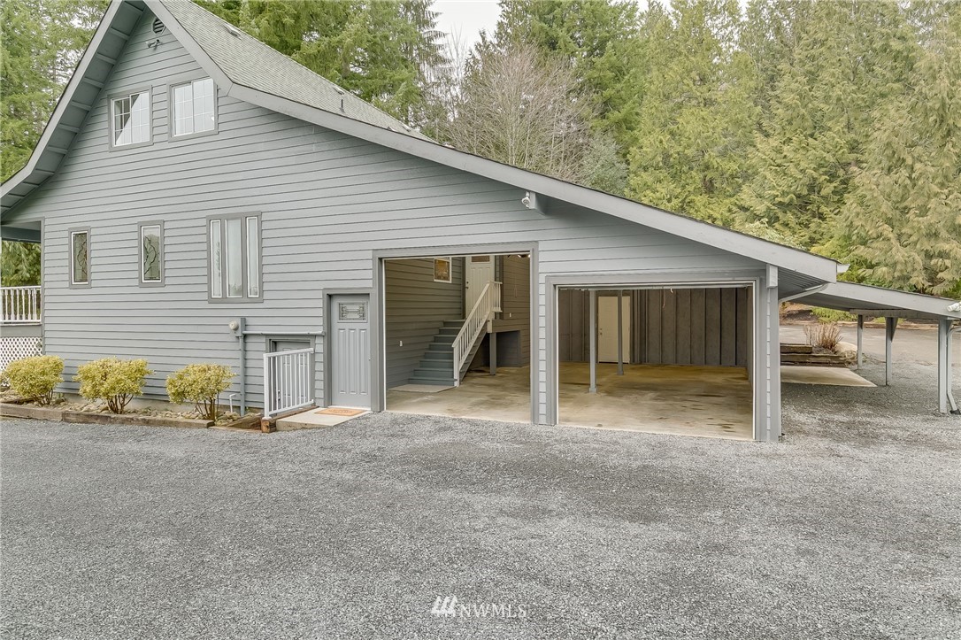 611 Newberg Road Snohomish, WA 98290 - Photo 5 of 40 a view of a house with a backyard and windows