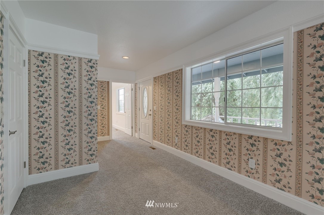 611 Newberg Road Snohomish, WA 98290 - Photo 7 of 40 a view of an empty room with a window
