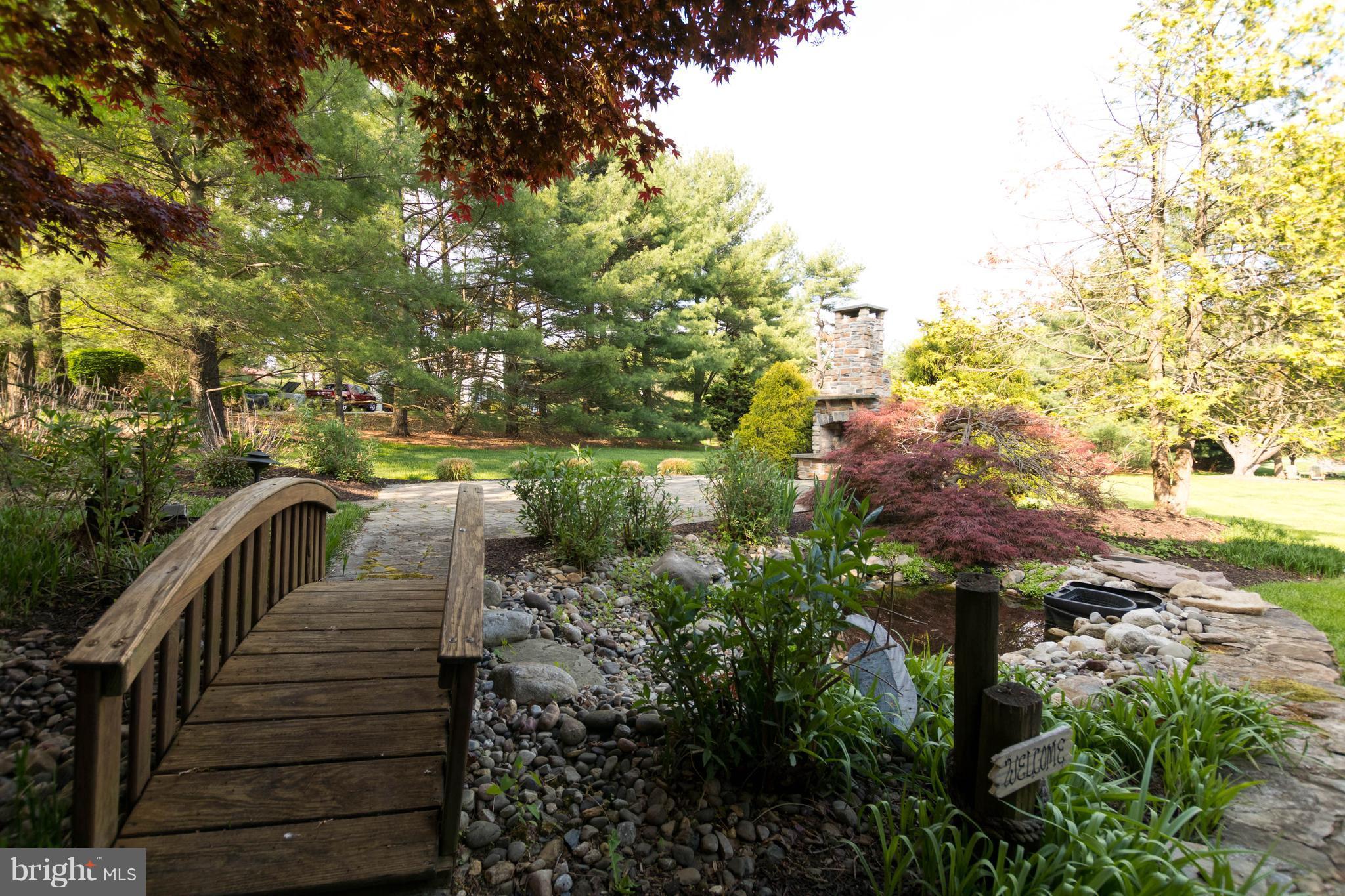 Bridge over pond to Patio