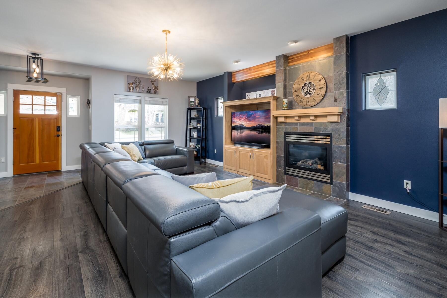 62732 Larkview Road Bend, OR 97701 - Photo 5 of 26 a living room with furniture and a fireplace