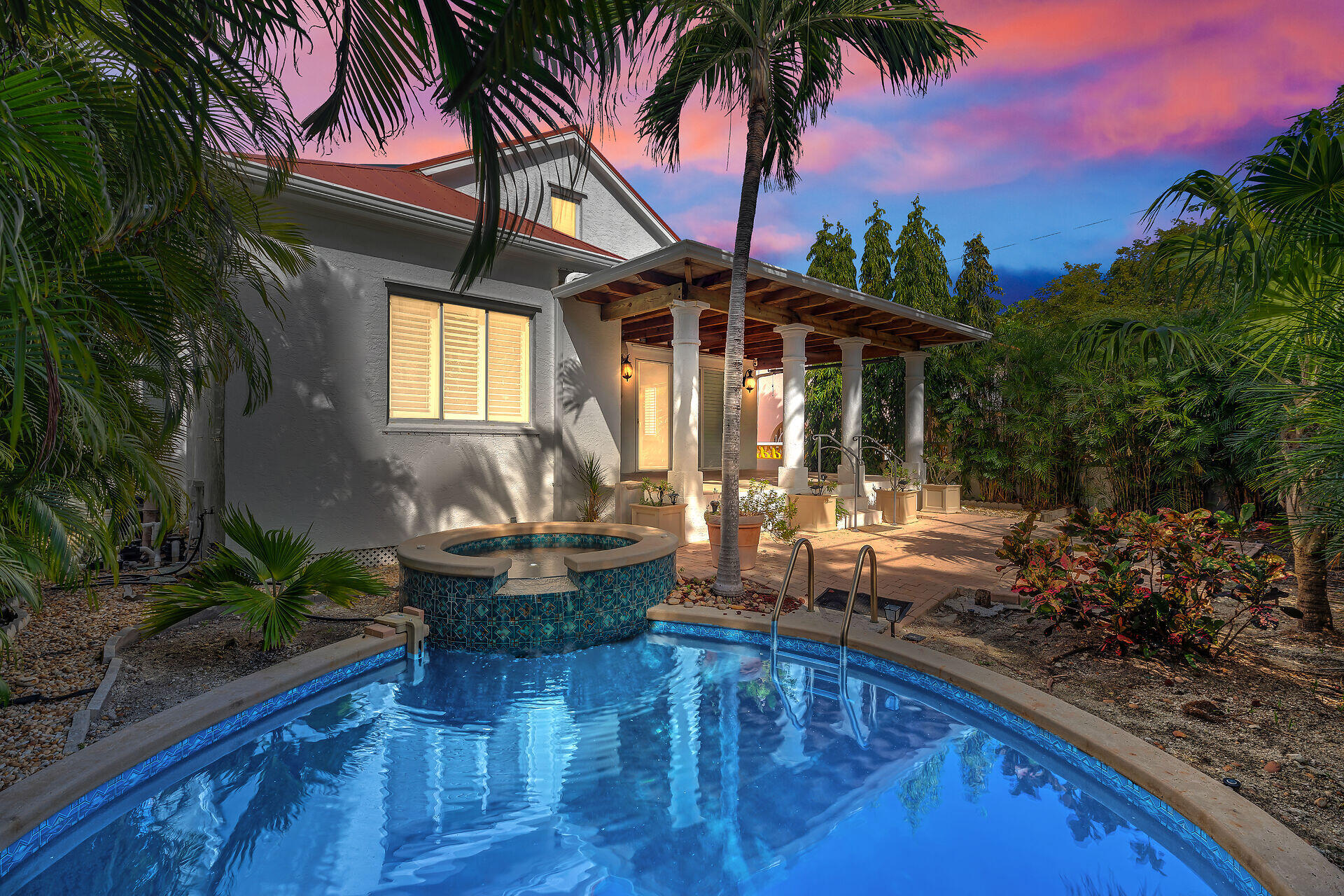 a house view with a sitting space and garden space