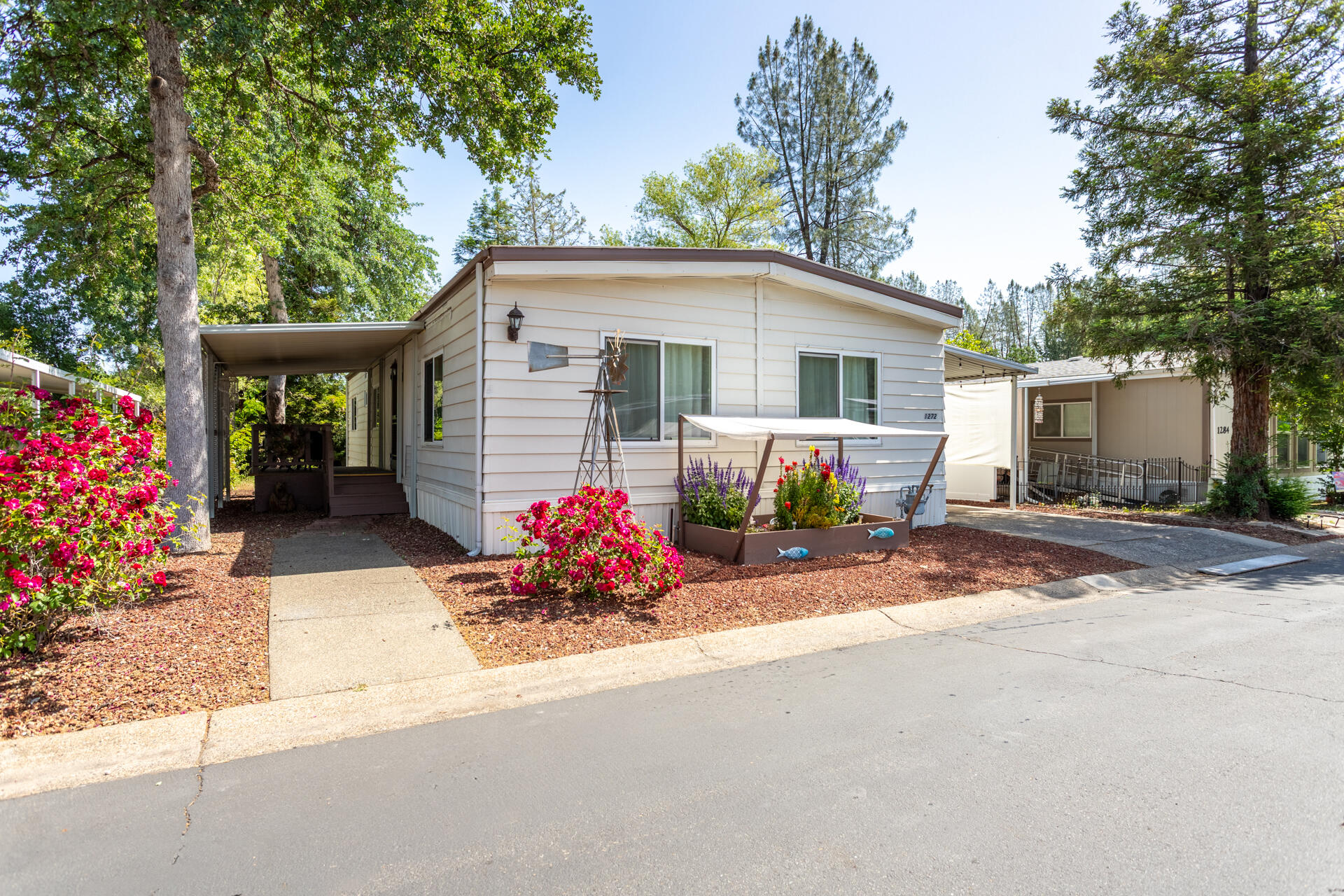 a front view of a house with a yard and a garage