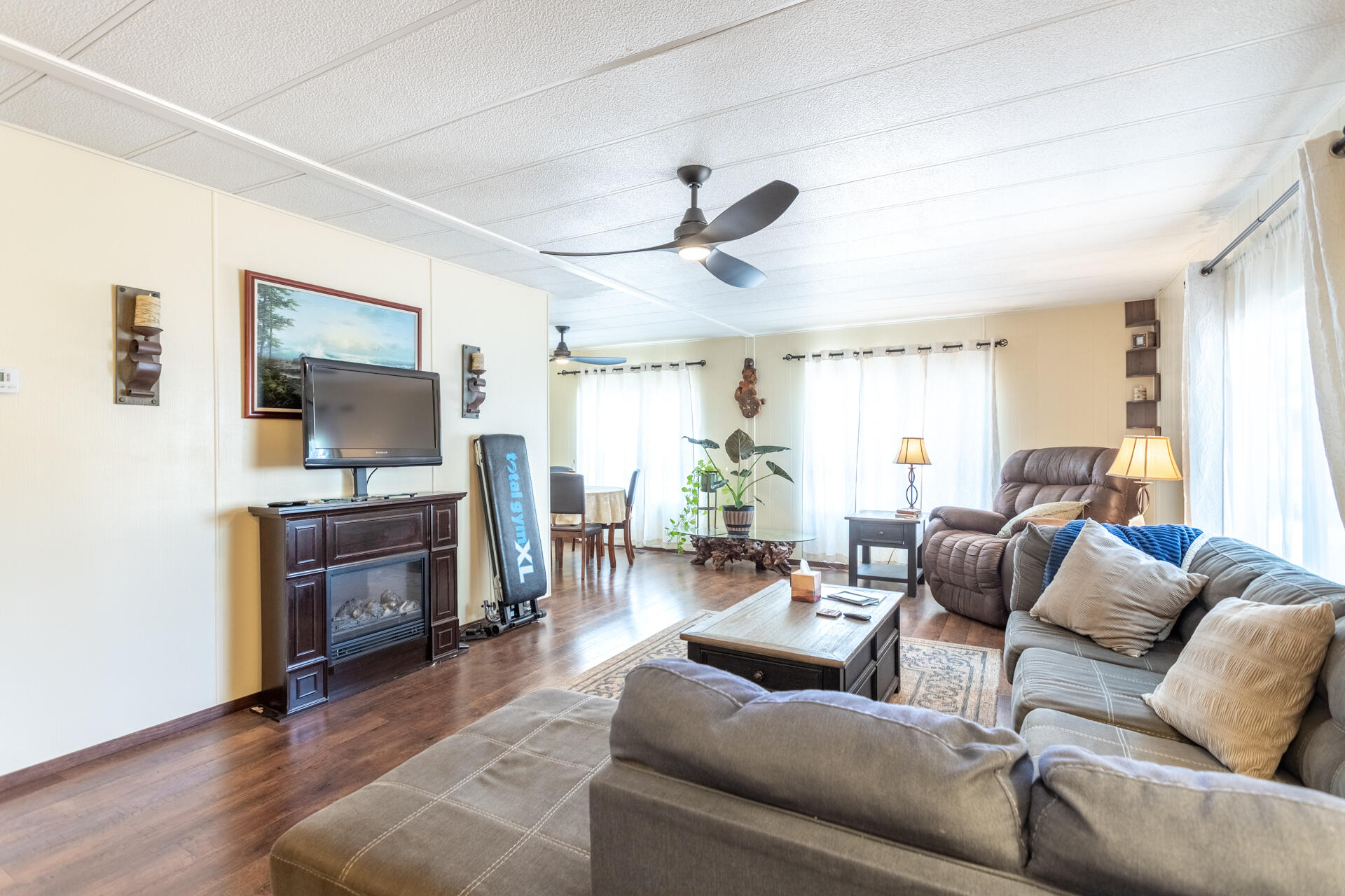 1272 Mountain Shadows Boulevard Redding, CA 96003 - Photo 11 of 22 a living room with furniture and a flat screen tv