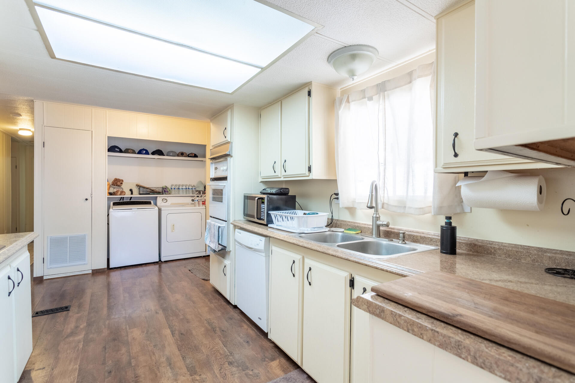 1272 Mountain Shadows Boulevard Redding, CA 96003 - Photo 13 of 22 a kitchen with a sink cabinets stainless steel appliances and a window