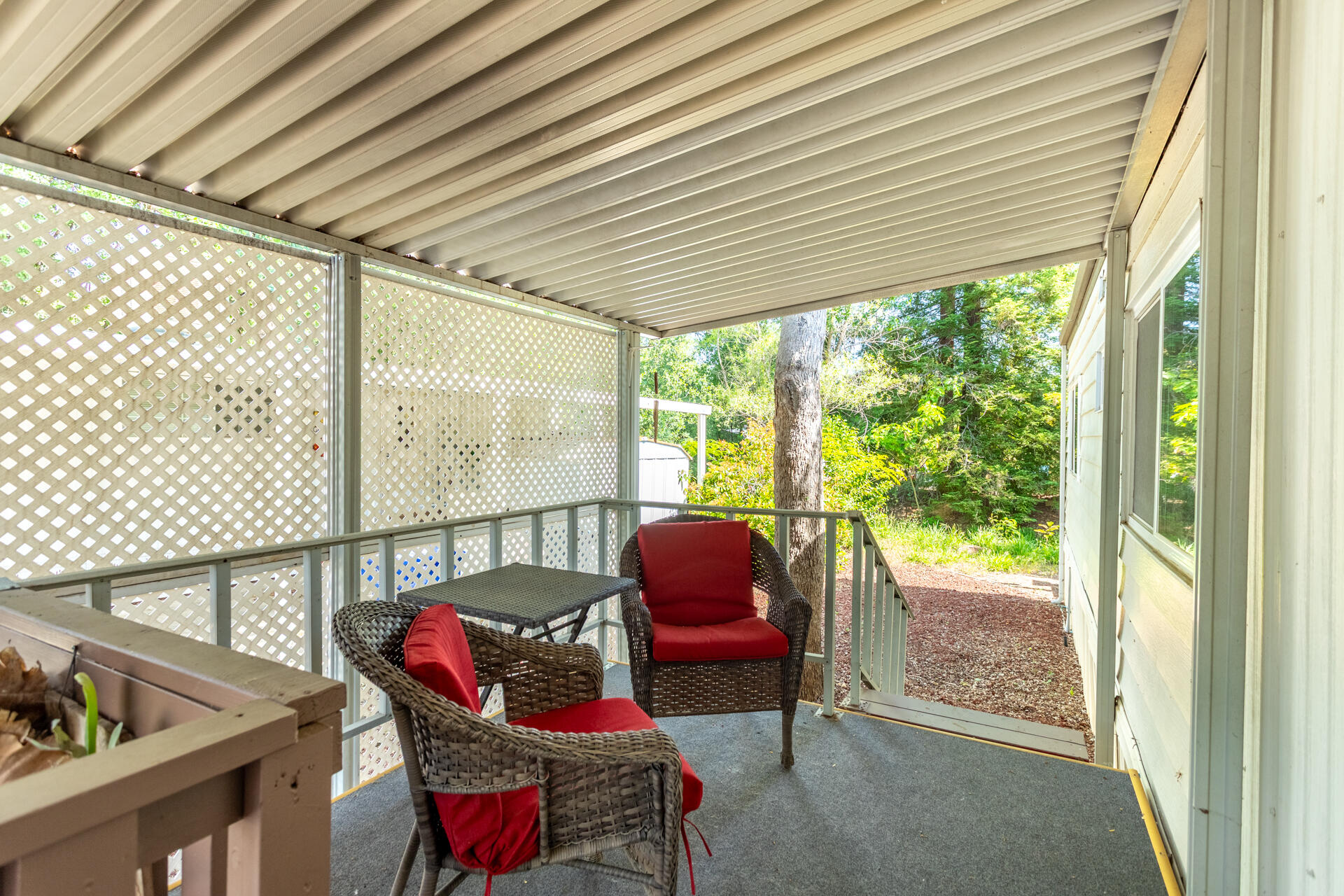 1272 Mountain Shadows Boulevard Redding, CA 96003 - Photo 17 of 22 a balcony with furniture and a potted plant