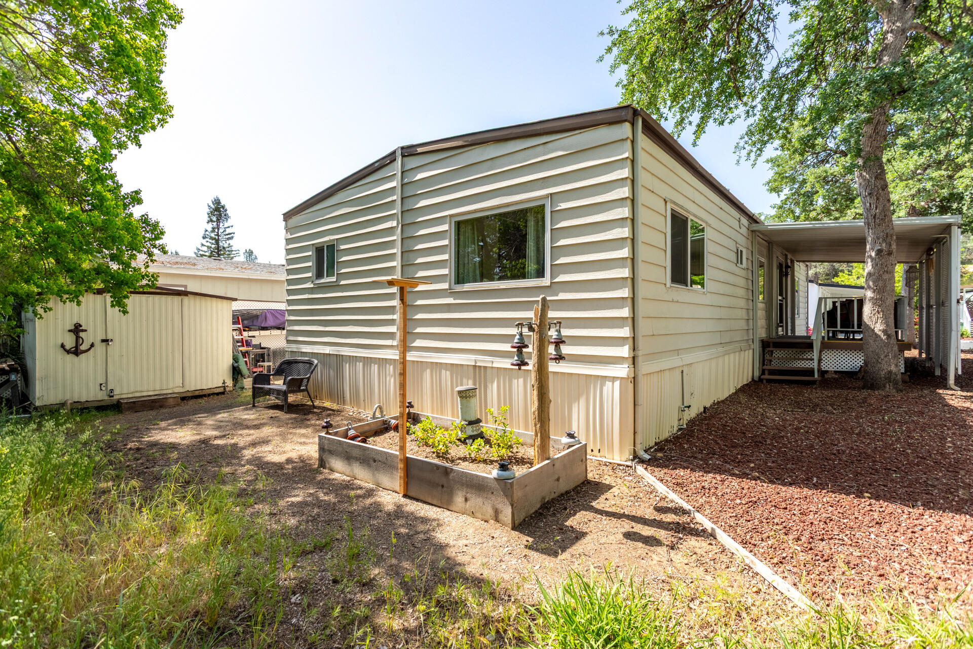 1272 Mountain Shadows Boulevard Redding, CA 96003 - Photo 18 of 22 a view of a house with backyard and sitting area