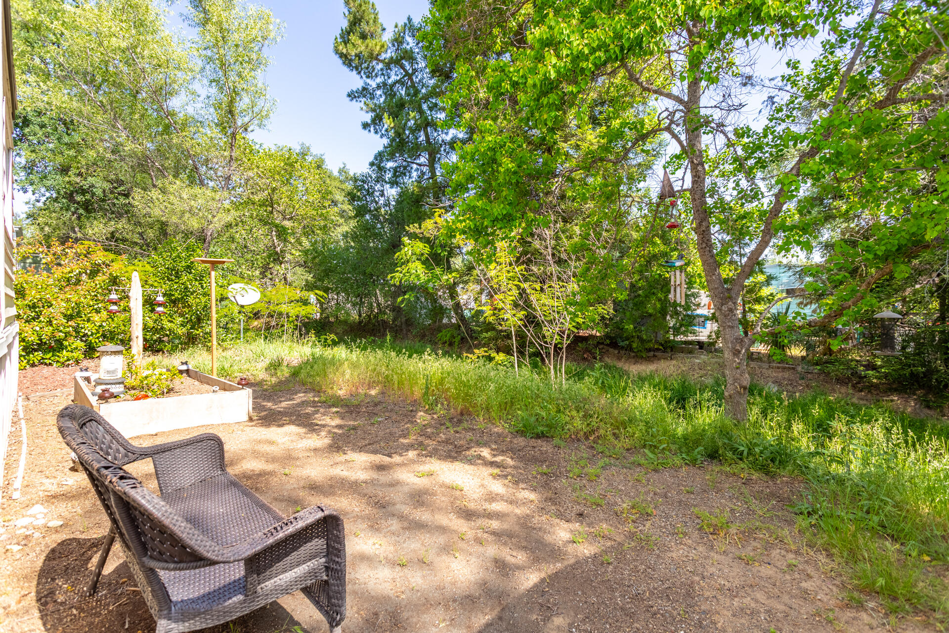 1272 Mountain Shadows Boulevard Redding, CA 96003 - Photo 19 of 22 a view of a lake with table and chairs