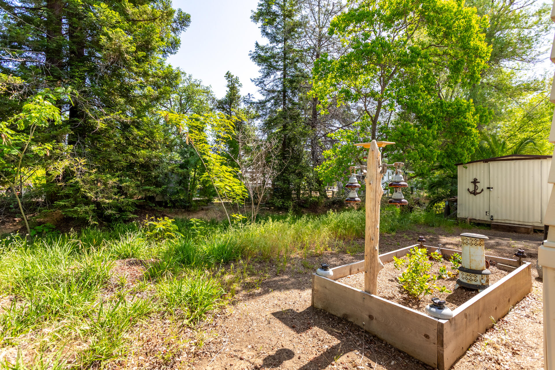 1272 Mountain Shadows Boulevard Redding, CA 96003 - Photo 21 of 22 a view of a backyard with couches chair and lake view