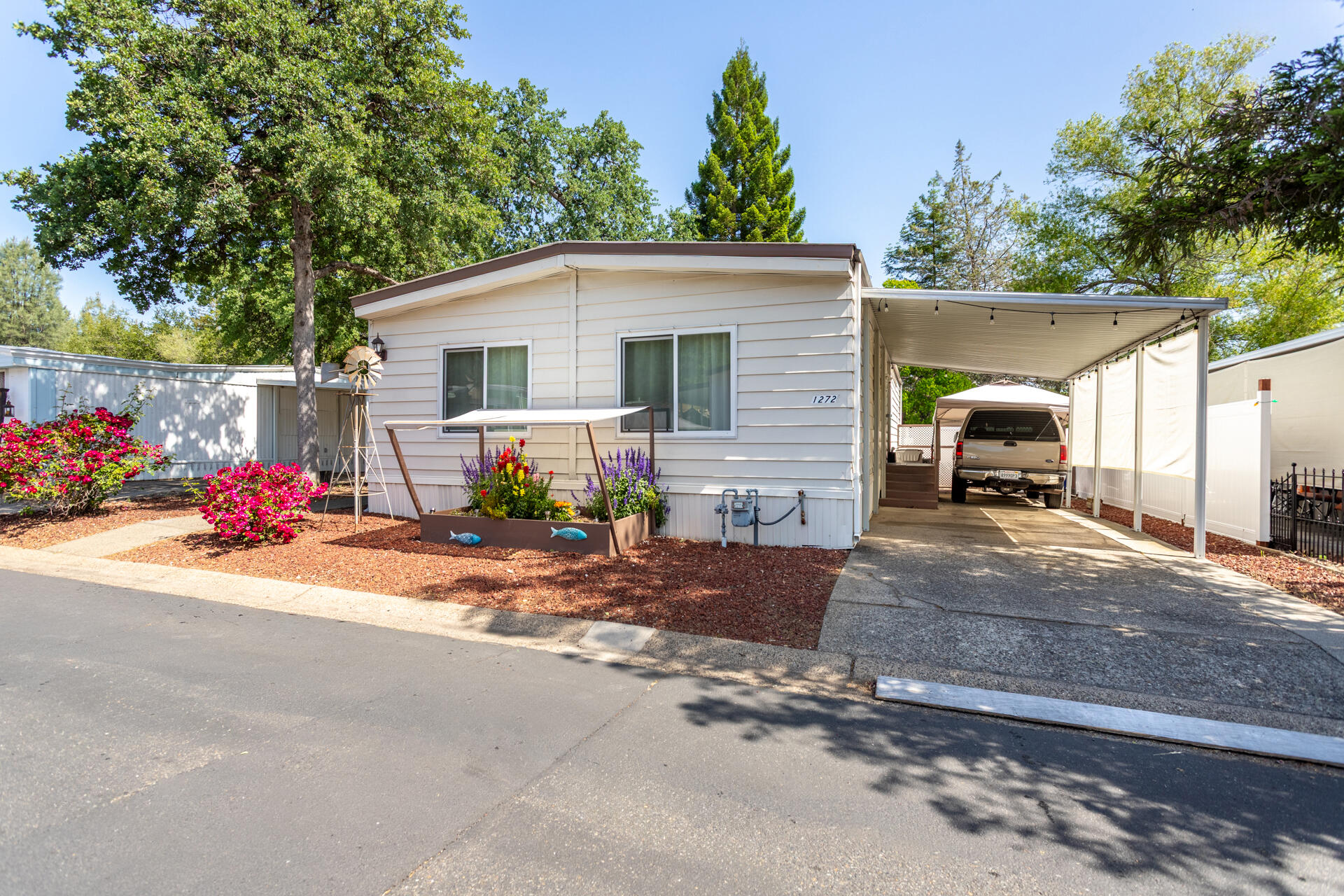 1272 Mountain Shadows Boulevard Redding, CA 96003 - Photo 22 of 22 a view of a backyard with a stove