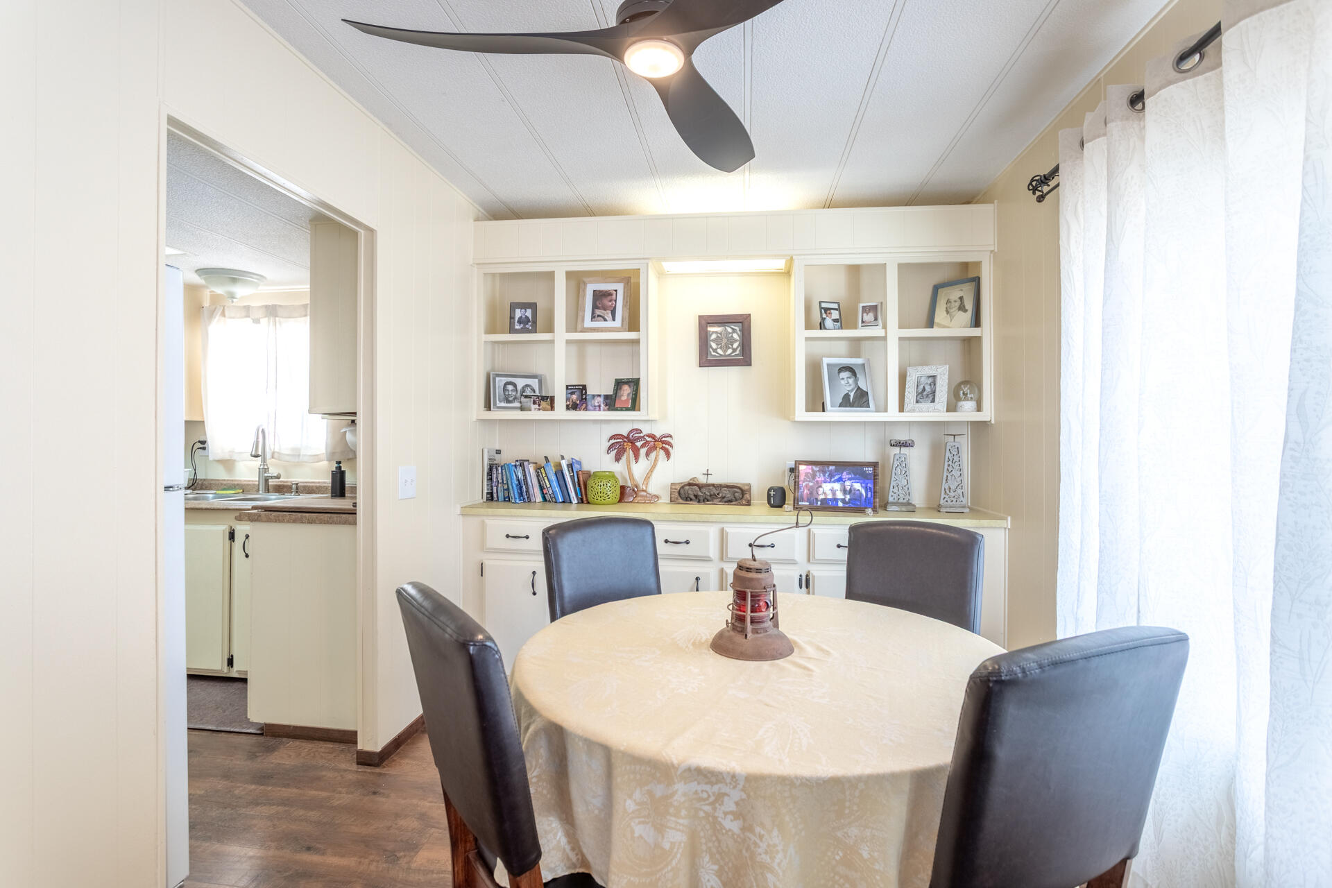 1272 Mountain Shadows Boulevard Redding, CA 96003 - Photo 3 of 22 a dining room with furniture a window and wooden floor