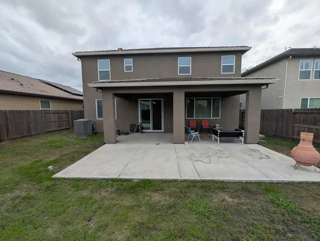 a view of a house with a yard and a garden