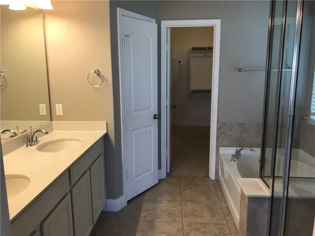 a bathroom with a sink and mirror