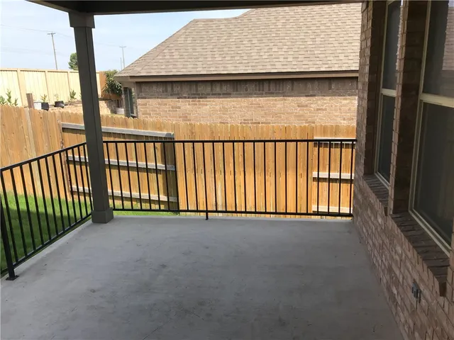 a view of wooden floor and a large window