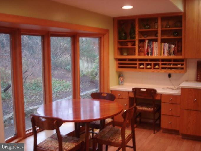 a dining room with a table and chairs