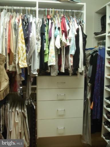 9213 Friars Road Bethesda, MD 20817 - Photo 10 of 15 a view of walk in closet with clothes and shoes