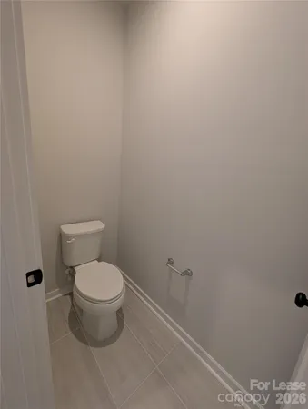 a bathroom with a double vanity sink and mirror with window