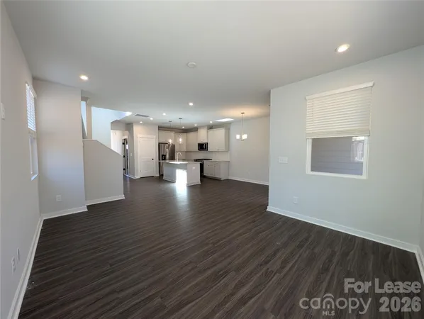 a view of kitchen with a table and chairs