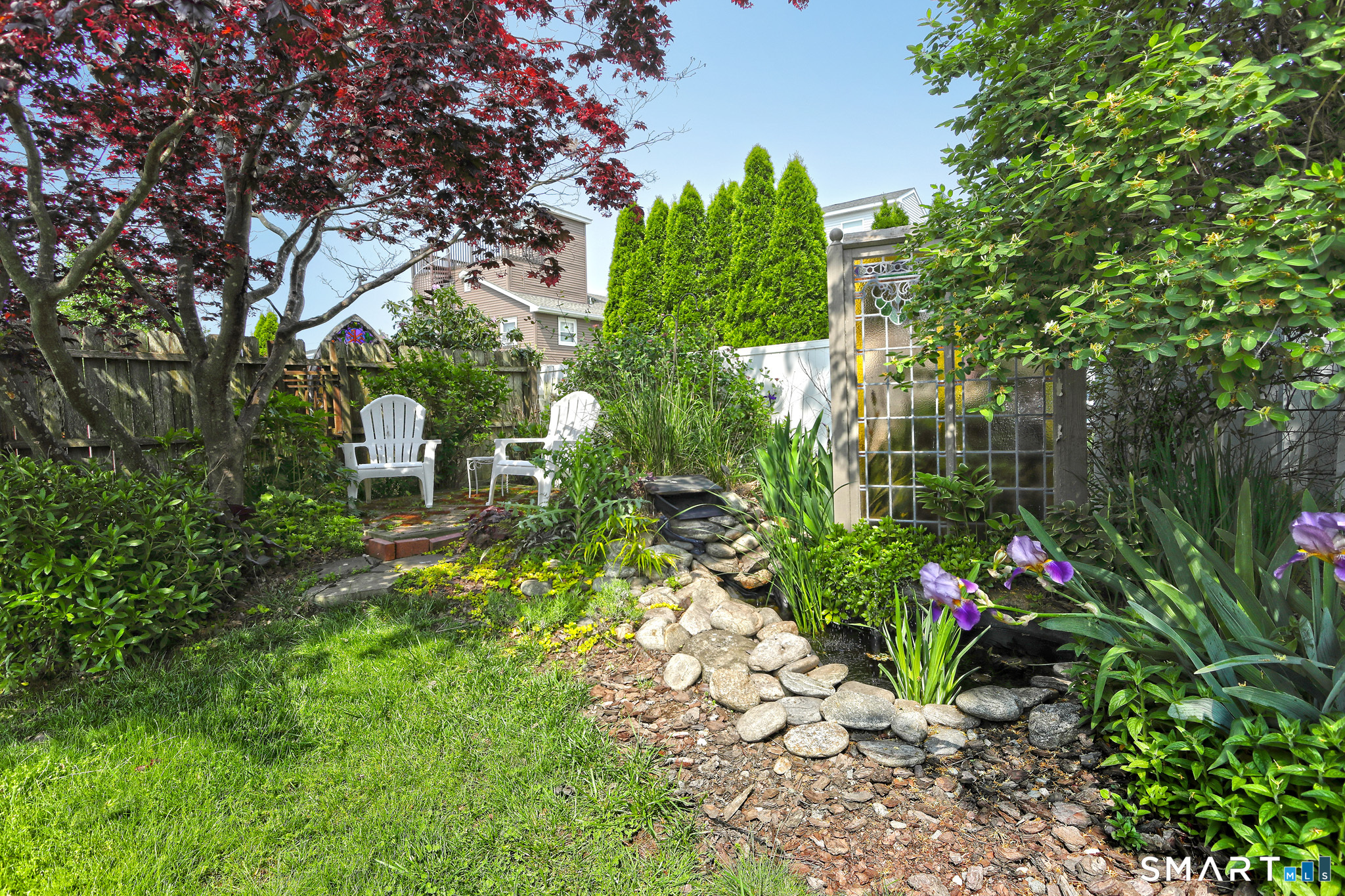 13 Billows Road Old Saybrook, CT 06475 - Photo 29 of 34 Backyard with a water fountain