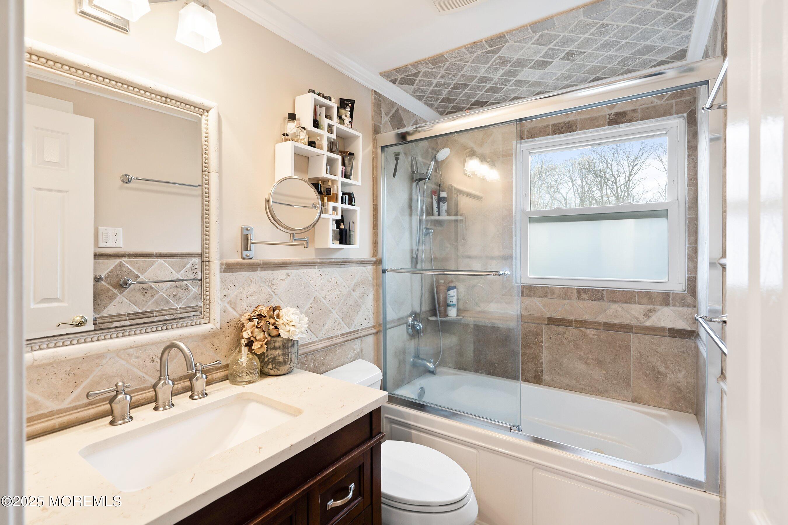 21 Drexel Drive Jackson, NJ 08527 - Photo 11 of 36 a bathroom with a sink mirror toilet and bathtub