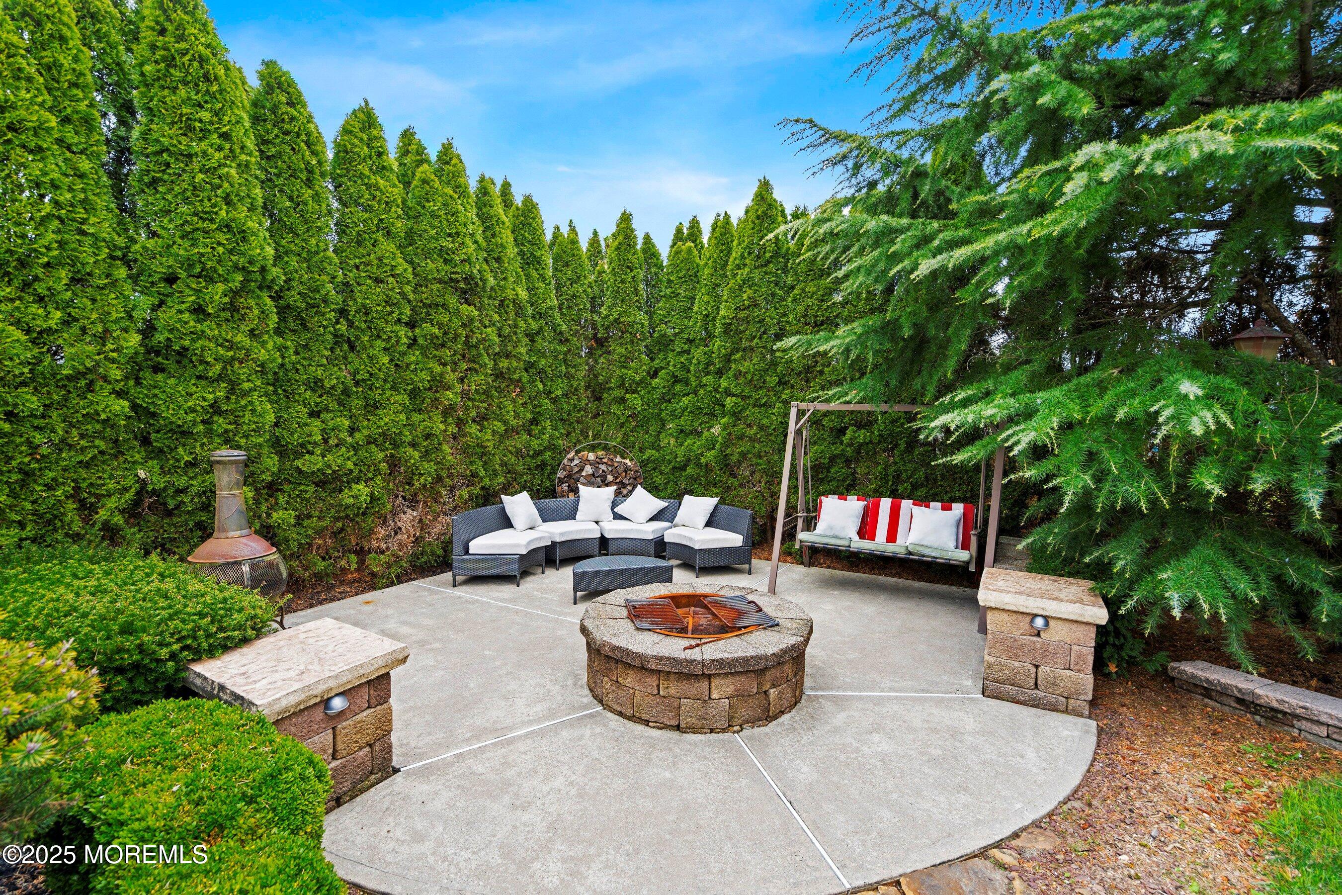 21 Drexel Drive Jackson, NJ 08527 - Photo 22 of 36 a view of a chairs and table in backyard