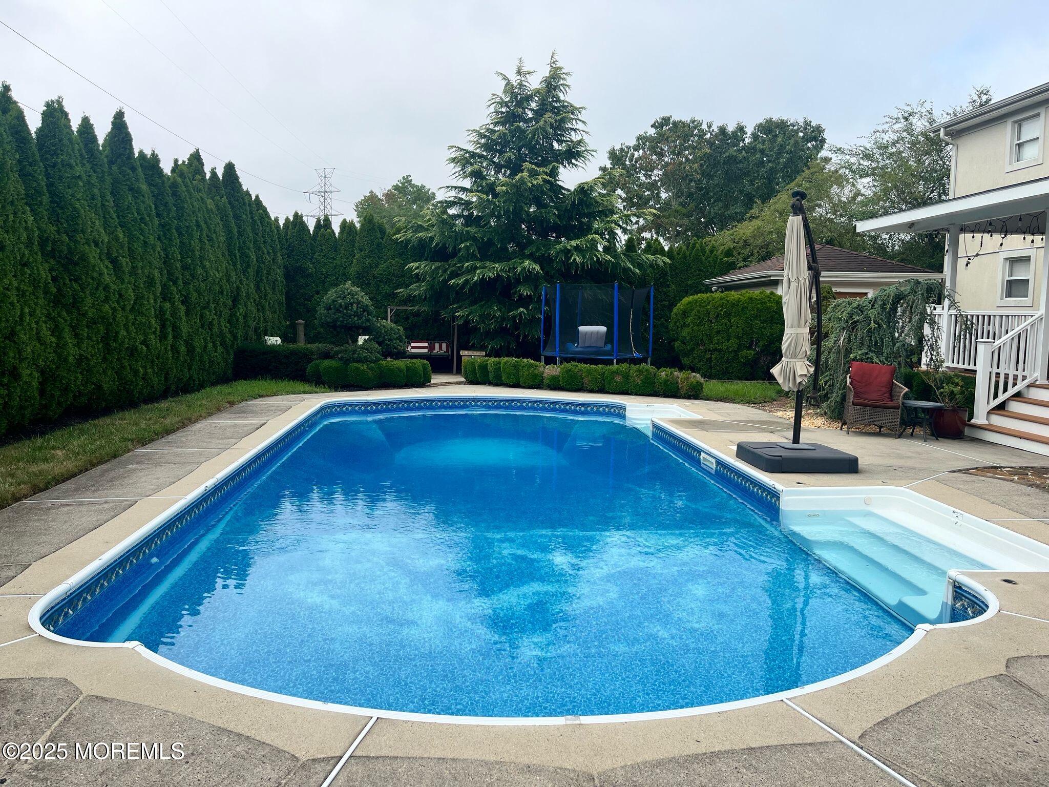 21 Drexel Drive Jackson, NJ 08527 - Photo 29 of 36 a view of a swimming pool with a patio