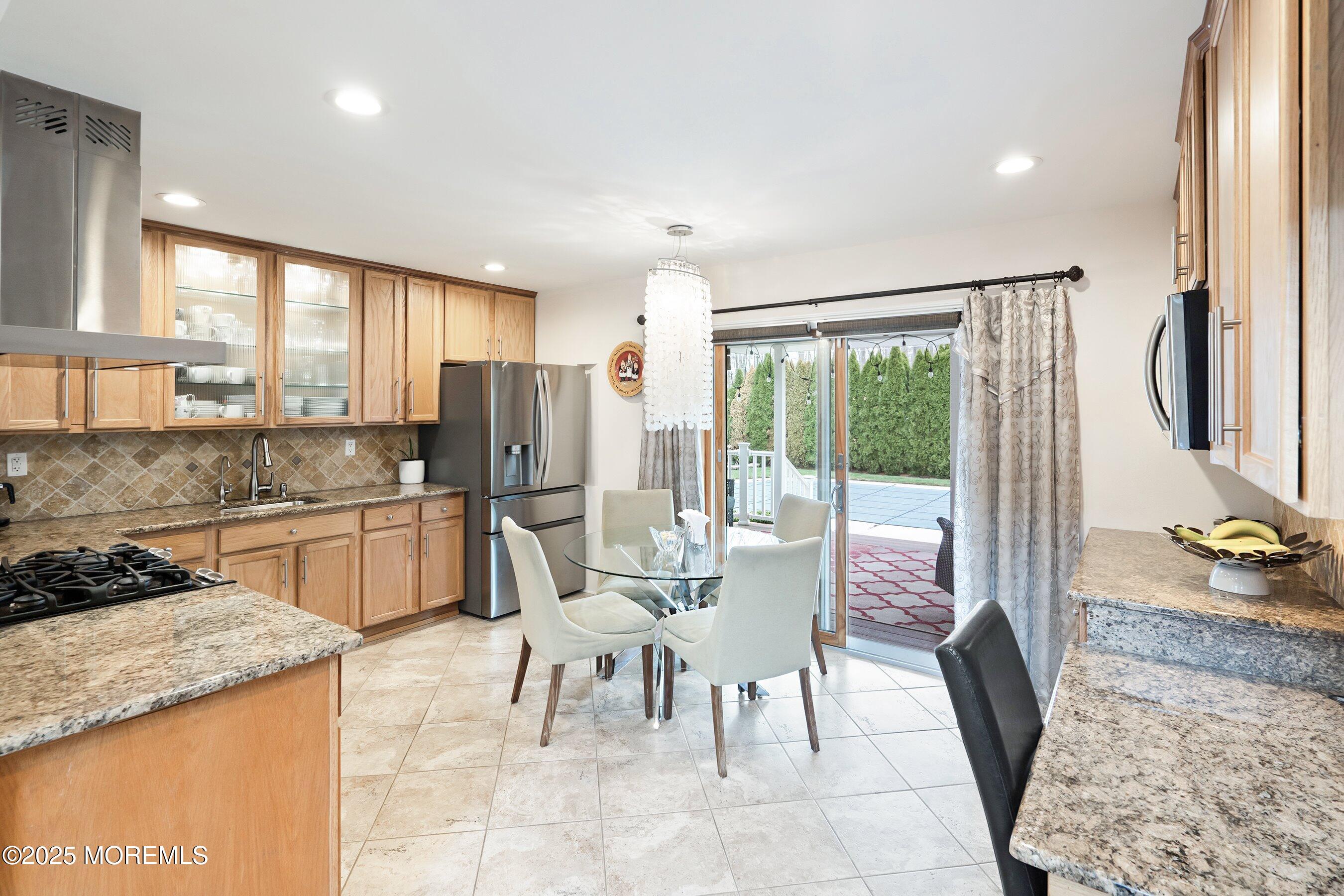 21 Drexel Drive Jackson, NJ 08527 - Photo 7 of 36 a view of a kitchen with dining table and chairs