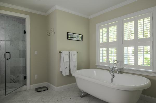 123 Bunker Hill Road Barnstable, MA 02655 - Photo 10 of 18 a bathroom with a white bath tub sitting next to a window