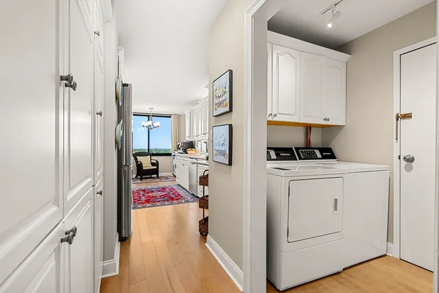 a view of living room with furniture and wooden floor