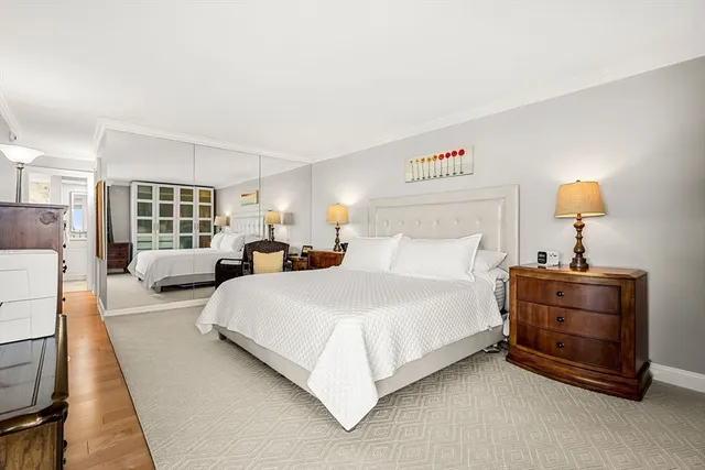 a bedroom with bed and window